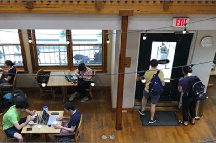 quiet coffee shop filled with people on laptops