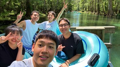 young people rafting on a river