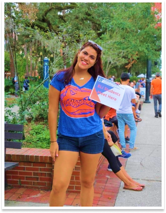 young woman in gator tee shirt on campus