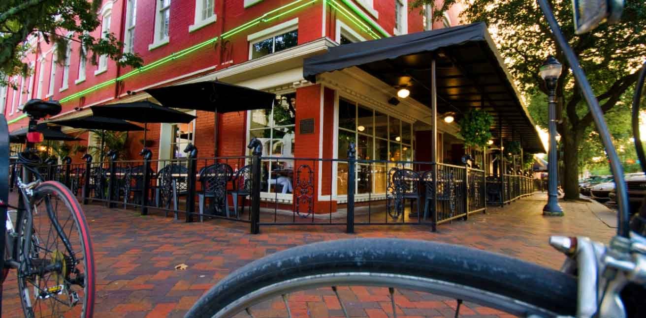 beautiful cafe with brick sidewalks lines with bikes