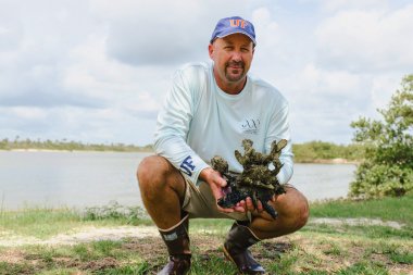 man outdoors near lake